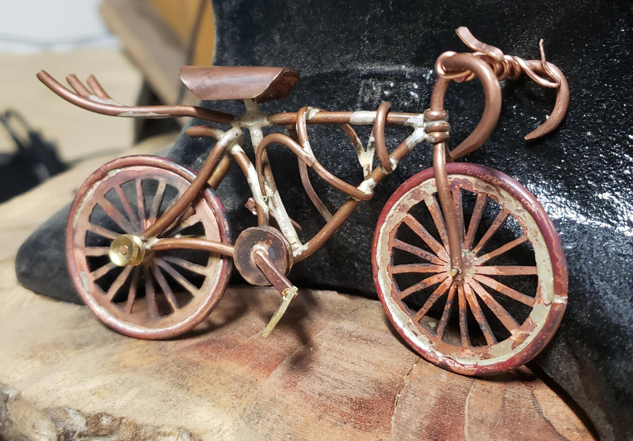 Brass and copper bicycle.